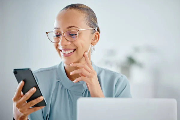 Smiling, excited and happy business woman texting, browsing and reading notification on phone with good news in an office. Cheerful executive scrolling messages, apps and web while networking online.