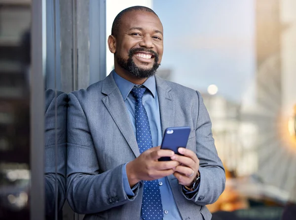 If youre always online, youll always have clients. a businessman using his cellphone while out in the city