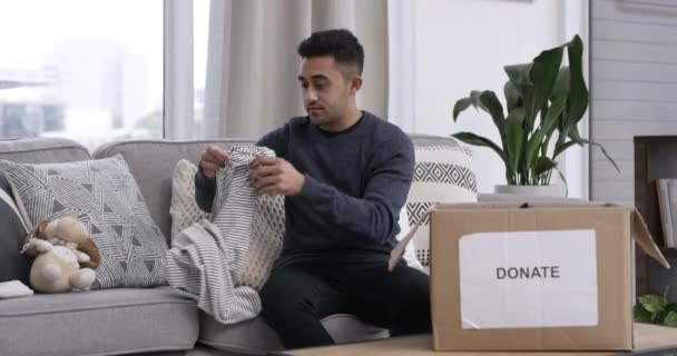 Video Footage Man Packing Items Donation Box While Sitting Home — Video Stock