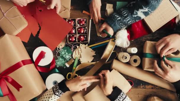 Video Footage Group Unrecognisable People Wrapping Christmas Gifts — Stockvideo