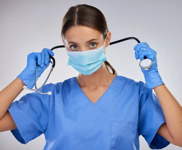 Equipment Makes Job Simpler Female Nurse Removing Her Stethoscope Studio — Zdjęcie stockowe