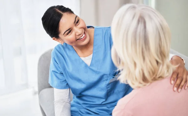 Happy Youre Feeling Better Female Nurse Smiling While Talking Her — Foto Stock