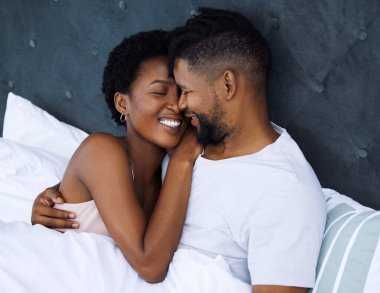 A deeper love is a different kind of connection. a young couple being intimate in bed at home