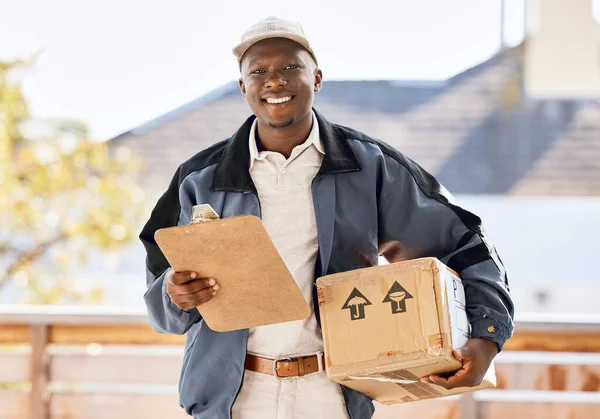 Delivery on time and service with a smile. young man delivering a package to a customer outside