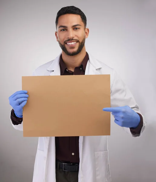 Check Out Handsome Young Doctor Standing Alone Studio Pointing Poster — Φωτογραφία Αρχείου