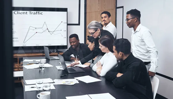 Just a few changes and it improves. a mature businesswoman giving a presentation to her staff