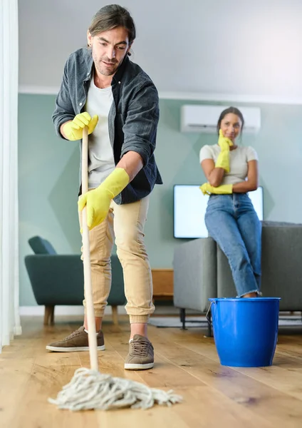 Thinks Hes Better Cleaning Young Man Mopping Floor While His —  Fotos de Stock
