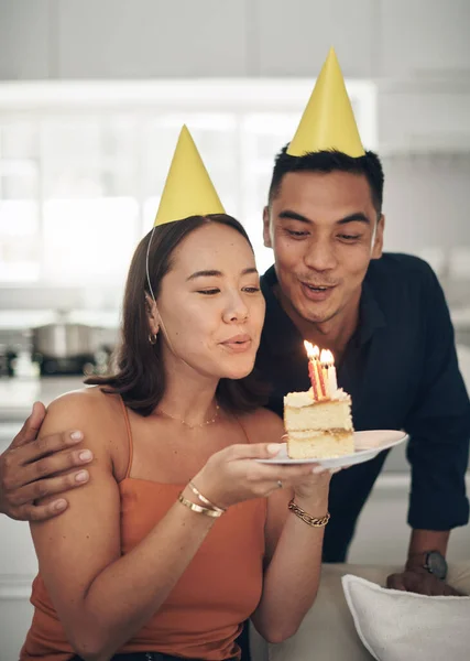 Make Wish Young Couple Blowing Out Candles Piece Cake Home — Zdjęcie stockowe