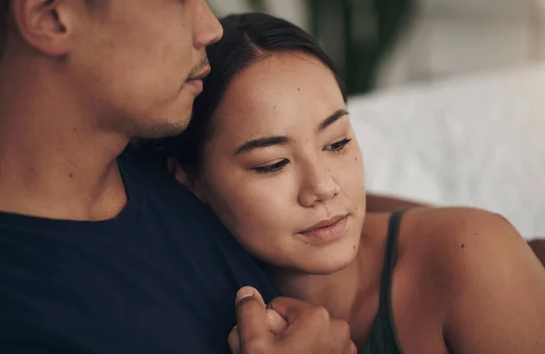 You are my source of comfort. a young couple relaxing together at home