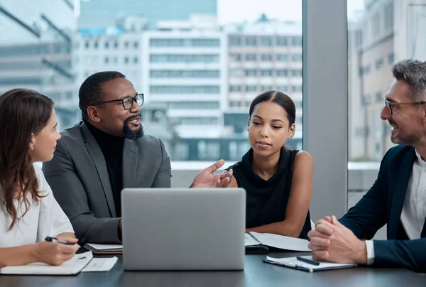 Success is found in the tiny details. a group of corporate business colleagues having a meeting around the table in the boardroom