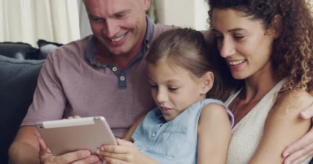 Happy Diverse Foster Family Browsing Tablet While Relaxing Living Room — Wideo stockowe