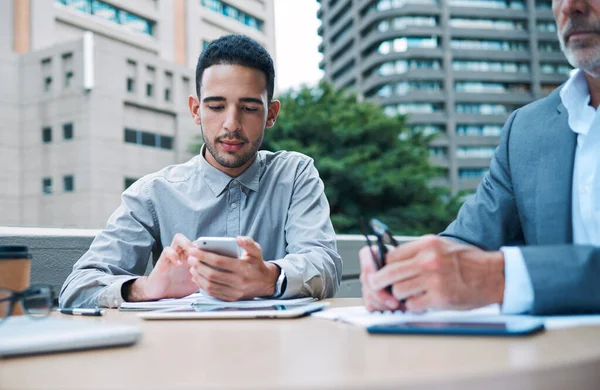 Tapping His Connections Some Assistance Young Businessman Using Cellphone Meeting — Stockfoto