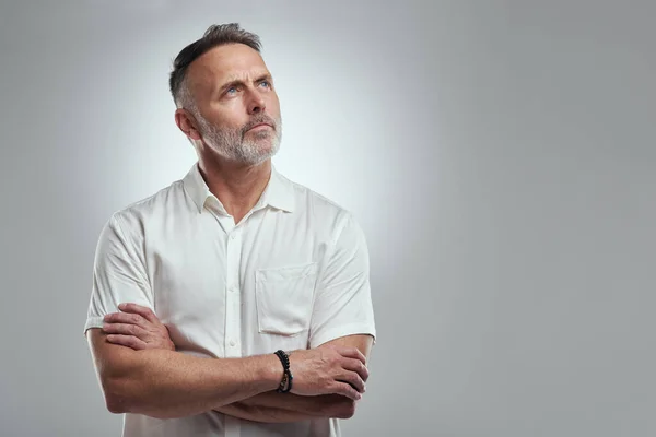 Brain Doesnt Quiet Studio Shot Mature Man Looking Thoughtful Grey — Stockfoto