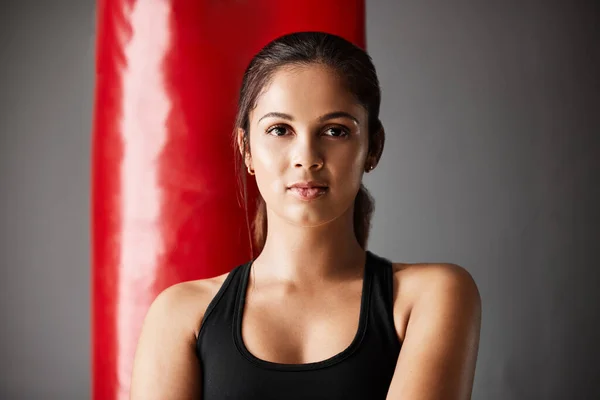 Boxing is my life. Cropped portrait of an attractive young female boxer training in the gym