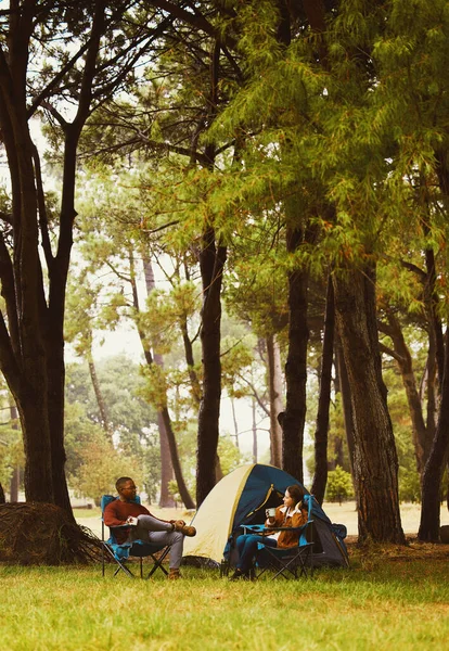 We dont need a holiday villa, we just need nature. a young couple camping in the wilderness