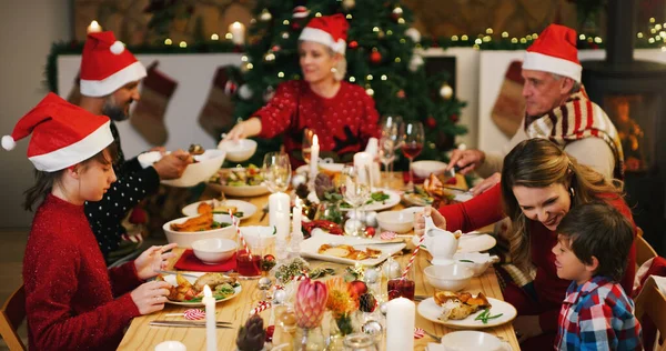 Theres a special kind of togetherness that only Christmas can bring. a happy family having Christmas lunch together at home