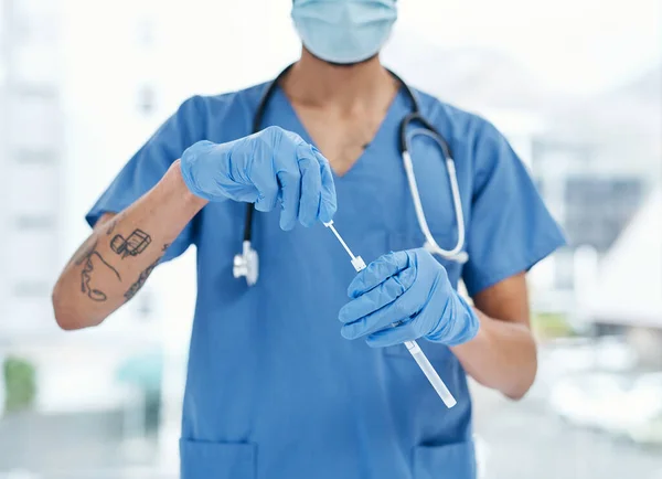 Every test leads to more accurate detection and diagnosis. Closeup shot of an unrecognisable medical practitioner holding a sampling swab