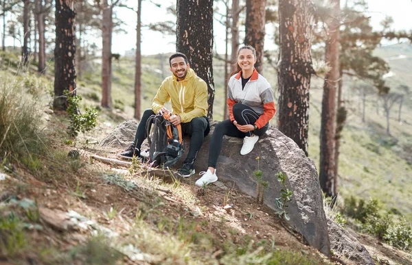 Friends who experience nature with you are keepers. Full length portrait of two young athletes sitting together after a morning run through the woods