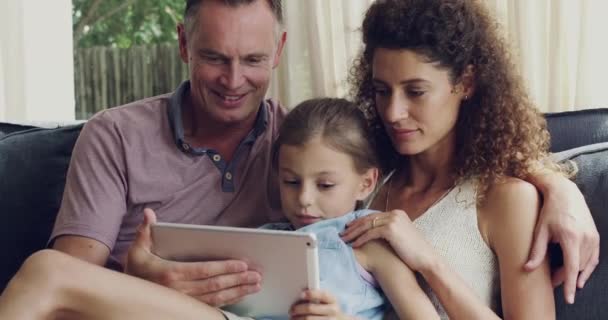 Happy Loving Cheerful Family Browsing Movie Online Tablet While Sitting — Stockvideo