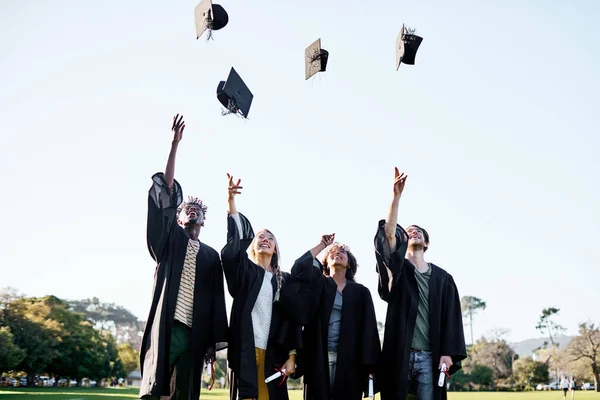 Thrilled New Milestone Group Students Throwing Hats Air Graduation Day — Photo