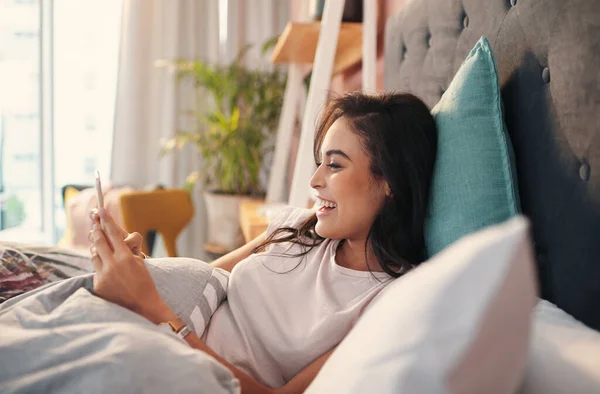 Staying Social While Chilling Bed Young Woman Using Cellphone While — Stockfoto