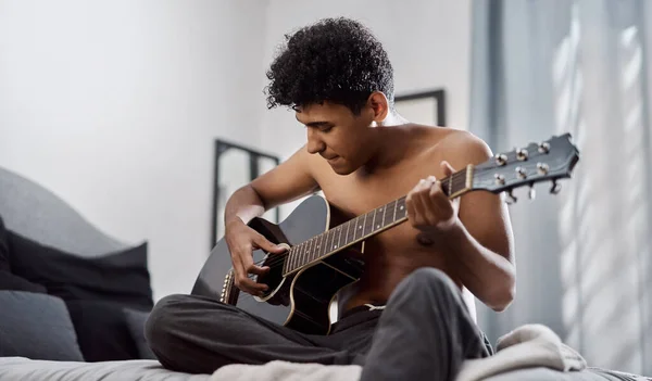 Good Music Makes Your Heart Beat Along With It A Young Man Playing The good-music-makes-your-heart-beat-along-with-it-a-young-man-playing-the