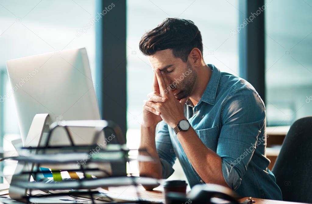 Stressed businessman with pain, headache or stress while working at office and looking tired exhausted and unhappy. Corporate worker feeling burnout and overworked failing to reach a deadline crisis.