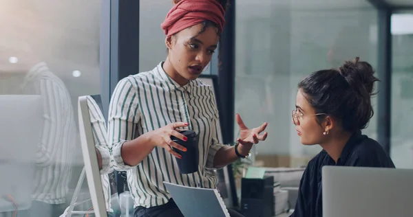 Lets think bigger. Youve got this. two attractive young businesswomen working together in the office