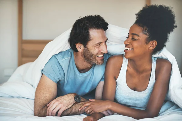 Happy Carefree Laughing Couple Having Fun Lying Bed Together Interracial — Stockfoto