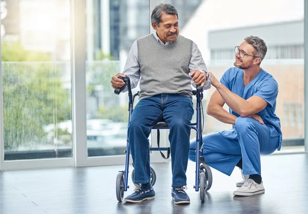 The right support makes a big difference to recovery. a nurse helping a senior man with a walker