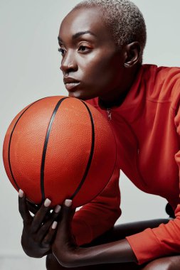 Better be ready for what shes about to bring. Studio shot of an attractive young woman playing basketball against a grey background