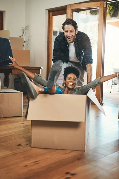 Fun Playful Laughing Homeowners Playing Box Enjoying New Home Real — 스톡 사진