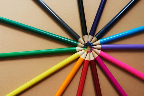 Live your life in full colour. Studio shot of different coloured pencils against a brown background