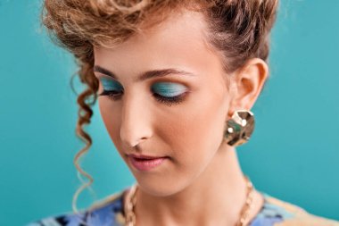 Get dressed, put on some makeup and add some bling. Studio shot of a beautiful young woman wearing a 80s outfit