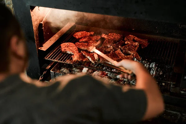 Hes Barbecuing Duties Closeup Shot Unrecognisable Man Grilling Meat While — Foto de Stock