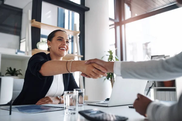 Its always a pleasure doing business with you. an attractive young businesswoman shaking hands with a colleague inside an office