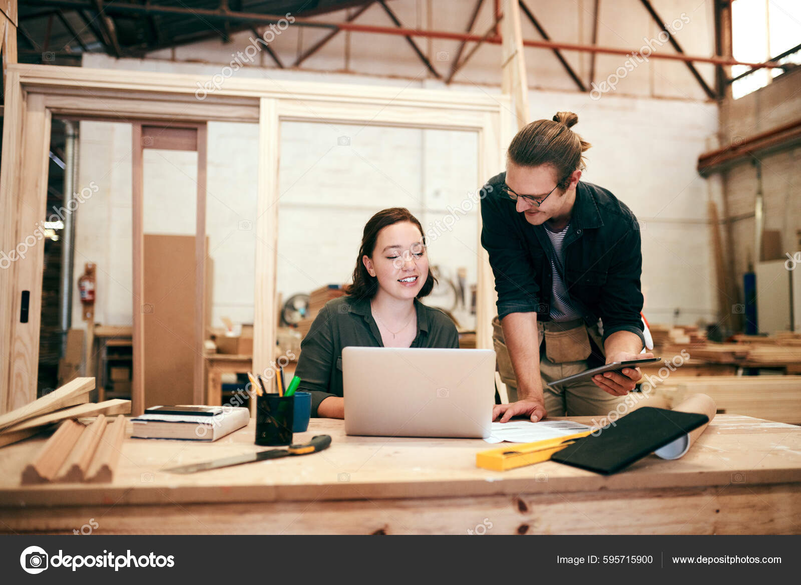 Were Getting Much Work Done Together Two Young Carpenters Using Stock