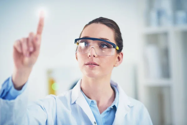 Innovation Name Game Focused Young Female Scientist Wearing Protective Glasses Stock Image