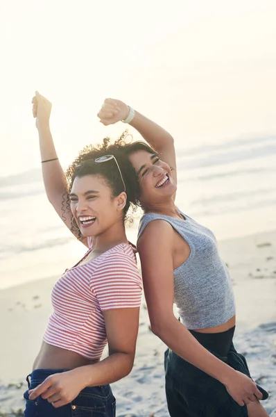 Friends make life awesome. two female friends spending the day at the beach