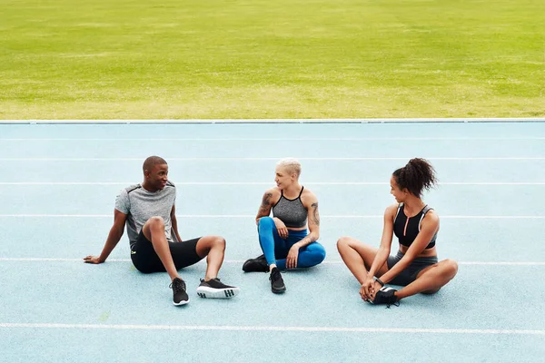 Relaxing Race Full Length Shot Diverse Group Athletes Sitting Together —  Fotos de Stock