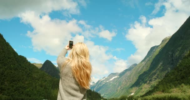 Female Travel Researcher Biologist Taking Phone Picture Green Mountain View — Stockvideo