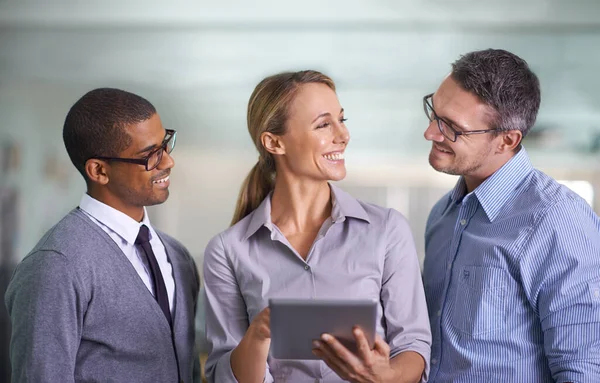 Happy, smiling and confident business woman with her team happy about a teamwork proposal collaboration. Corporate office workers with a tablet. Staff ready to work on a group job together.