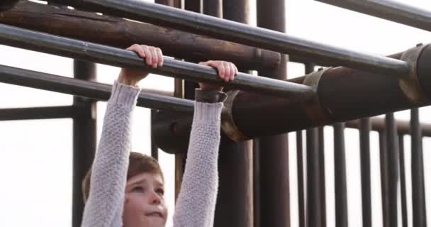 Fun Playful Boy Playing Monkey Bars Jungle Gym Playground Park — Vídeo de stock