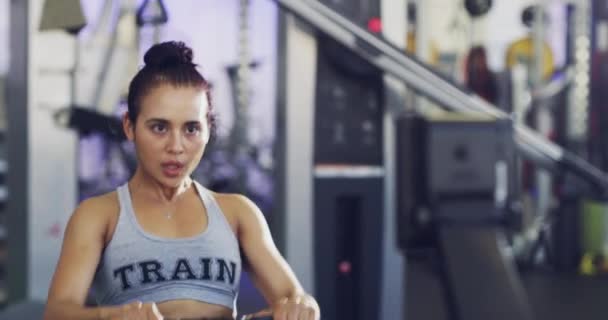 Serious Fit Active Woman Sweating Gym While Exercising Rowing Machine — Stockvideo