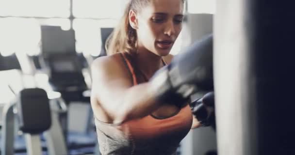 Strong Determined Fit Woman Boxing Training Exercising Gym Punching Bag — Stockvideo