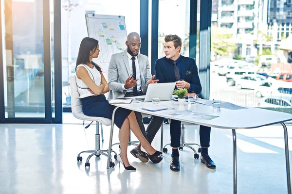 Putting His Input Table Full Length Shot Group Young Businesspeople — Stockfoto