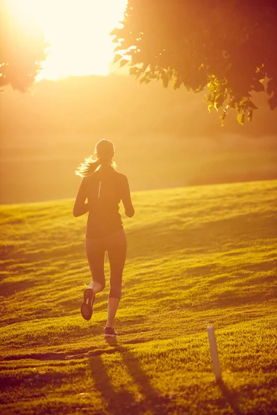 Fitness Her Focus Rearview Shot Sporty Young Woman Exercising Outdoors — Fotografia de Stock