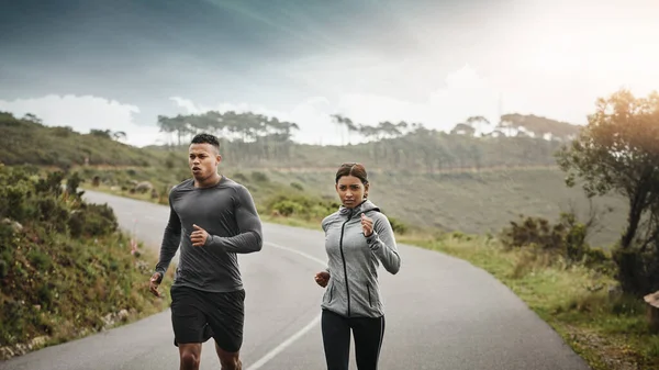 Get Those Hearts Racing Two Sporty Young People Running Outdoors — Stok fotoğraf
