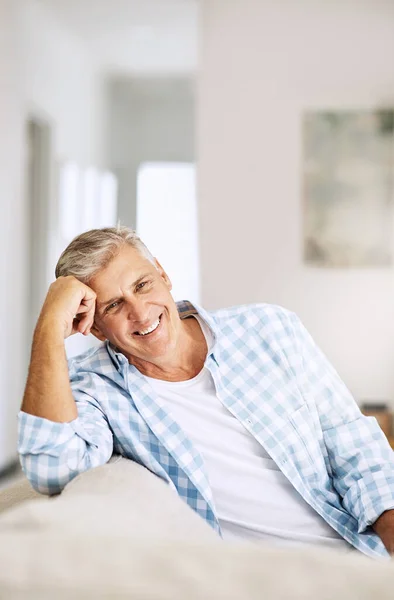 Casual Relaxed Happy Mature Man Smiling Indoors His Couch Home — Fotografia de Stock