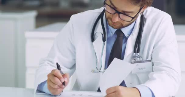 Happy Confident Smiling Doctor Sitting Office Writing Prescriptions Male Working — Vídeo de Stock